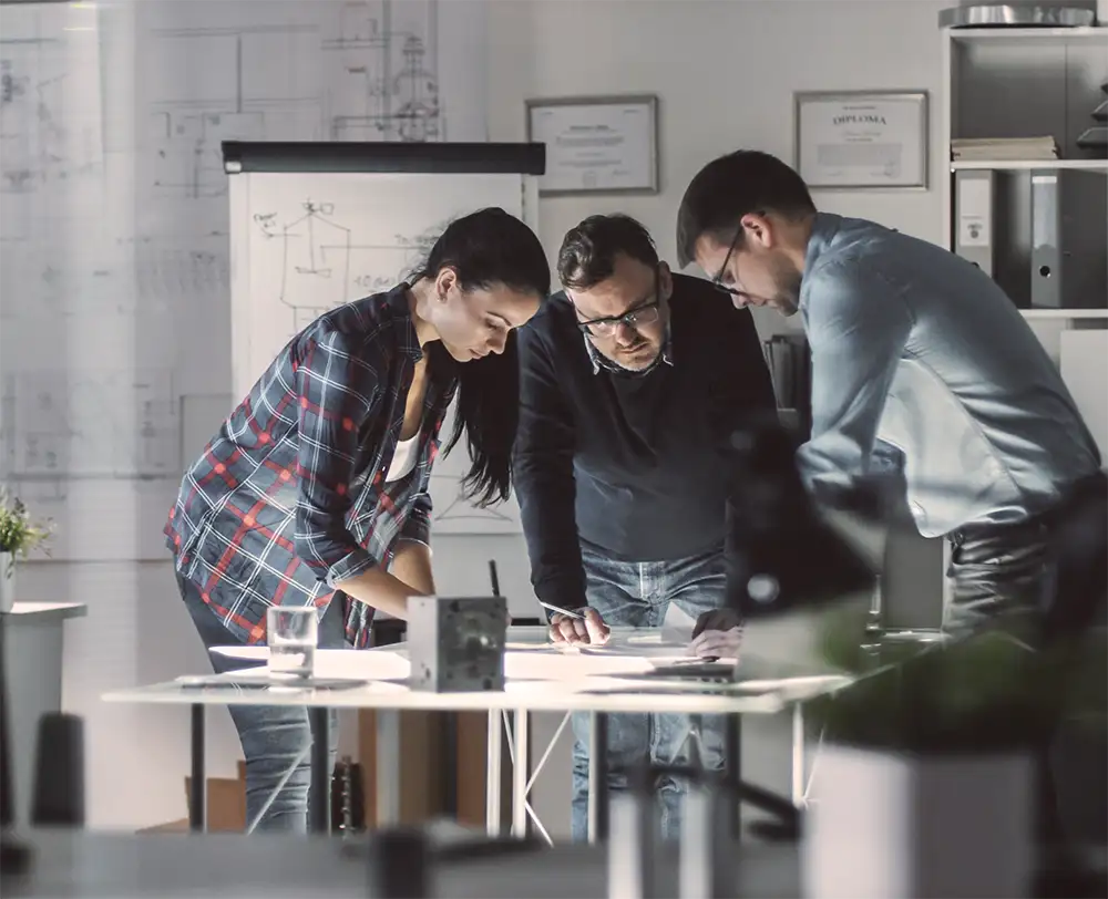 Business partners planning together over documents