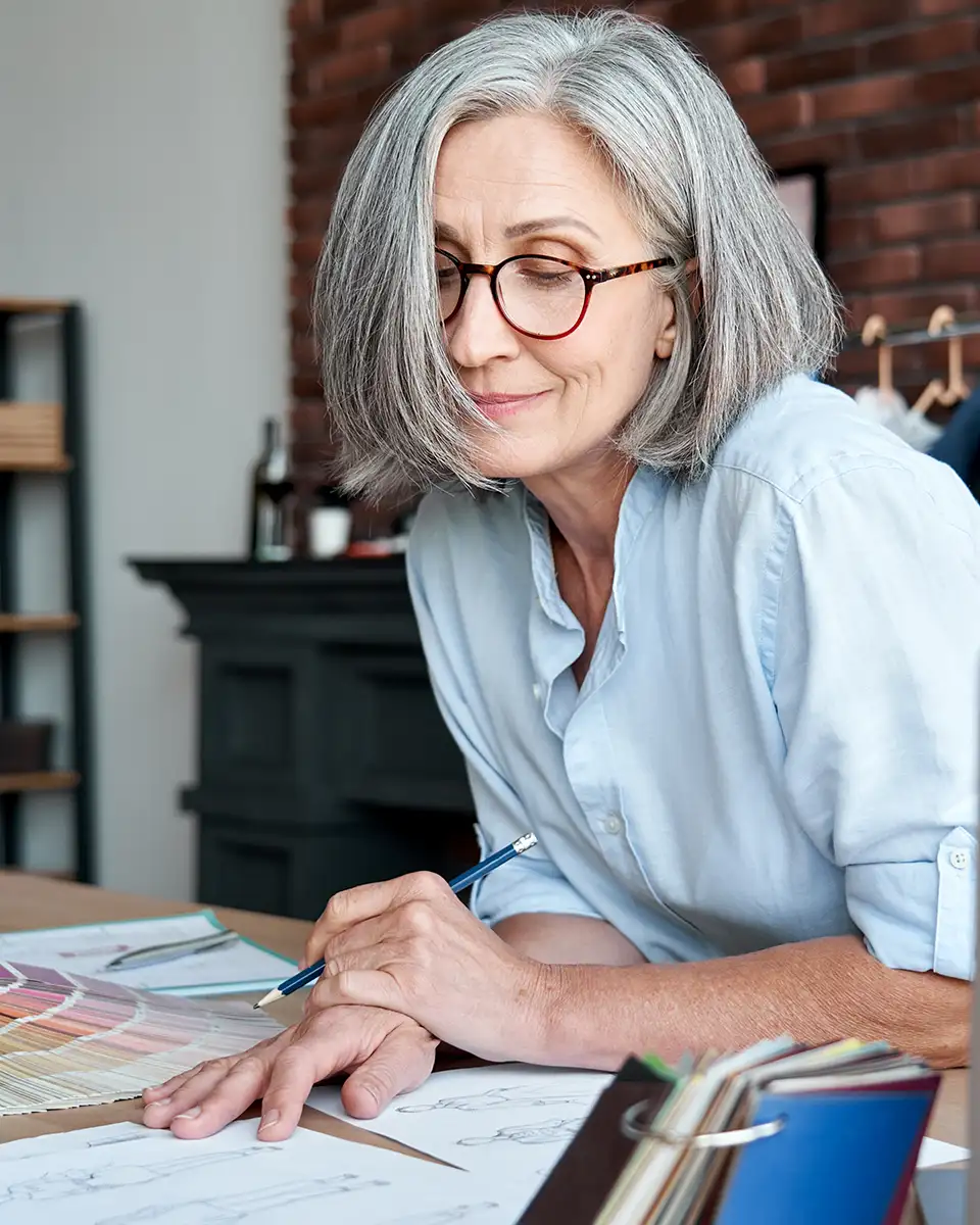 Business owner reviewing her finances with confidence